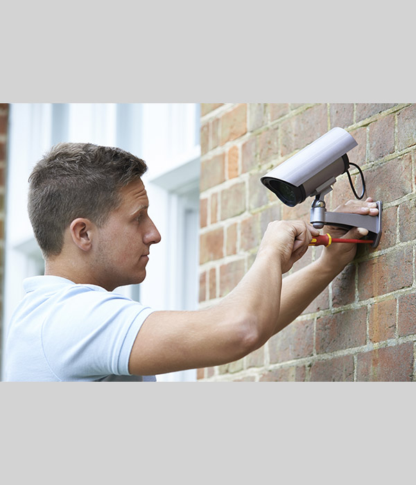 Man installing Surveillance Camera